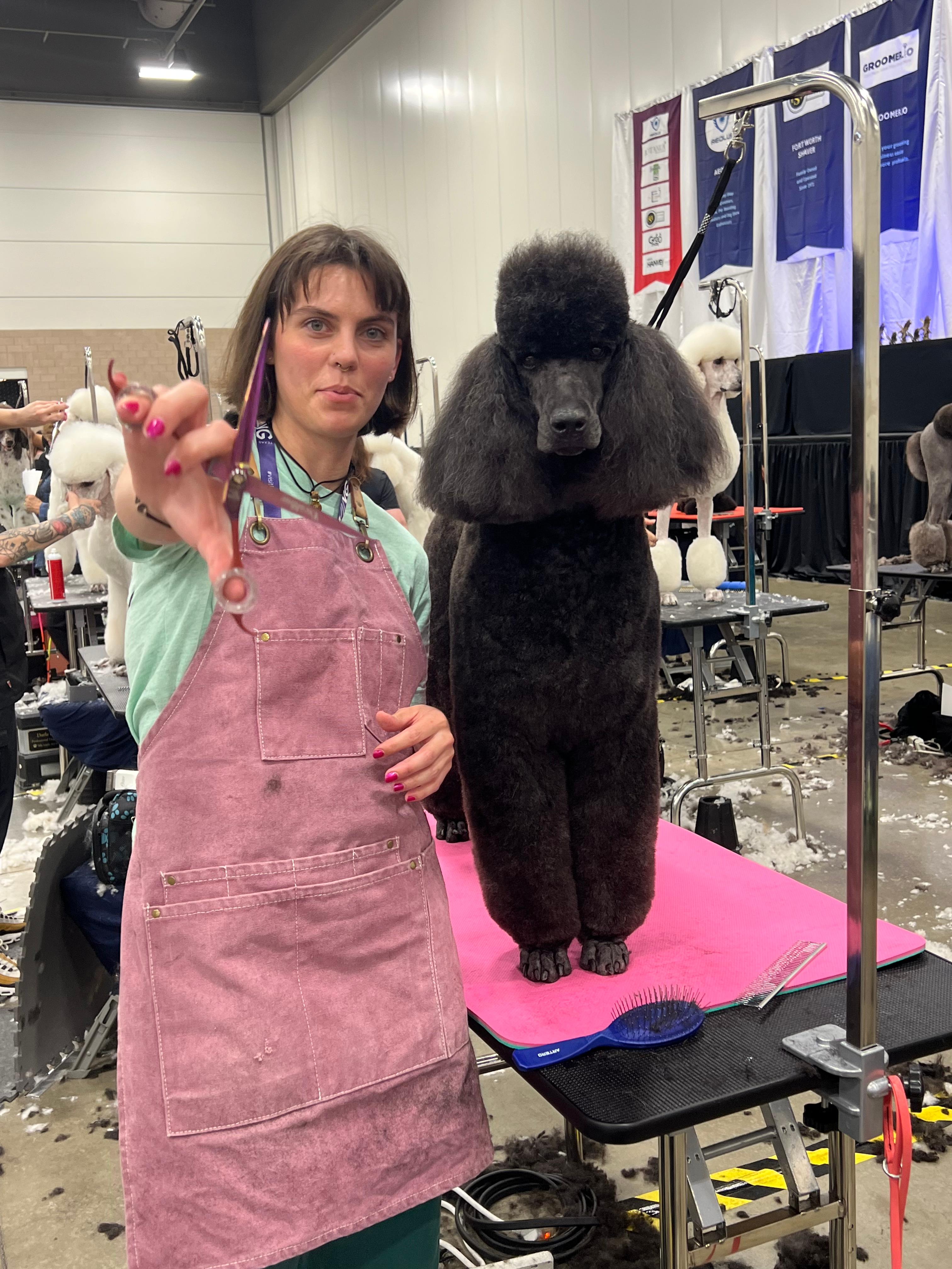 Ginnie Raye with a Poodle at a Dog Competition 