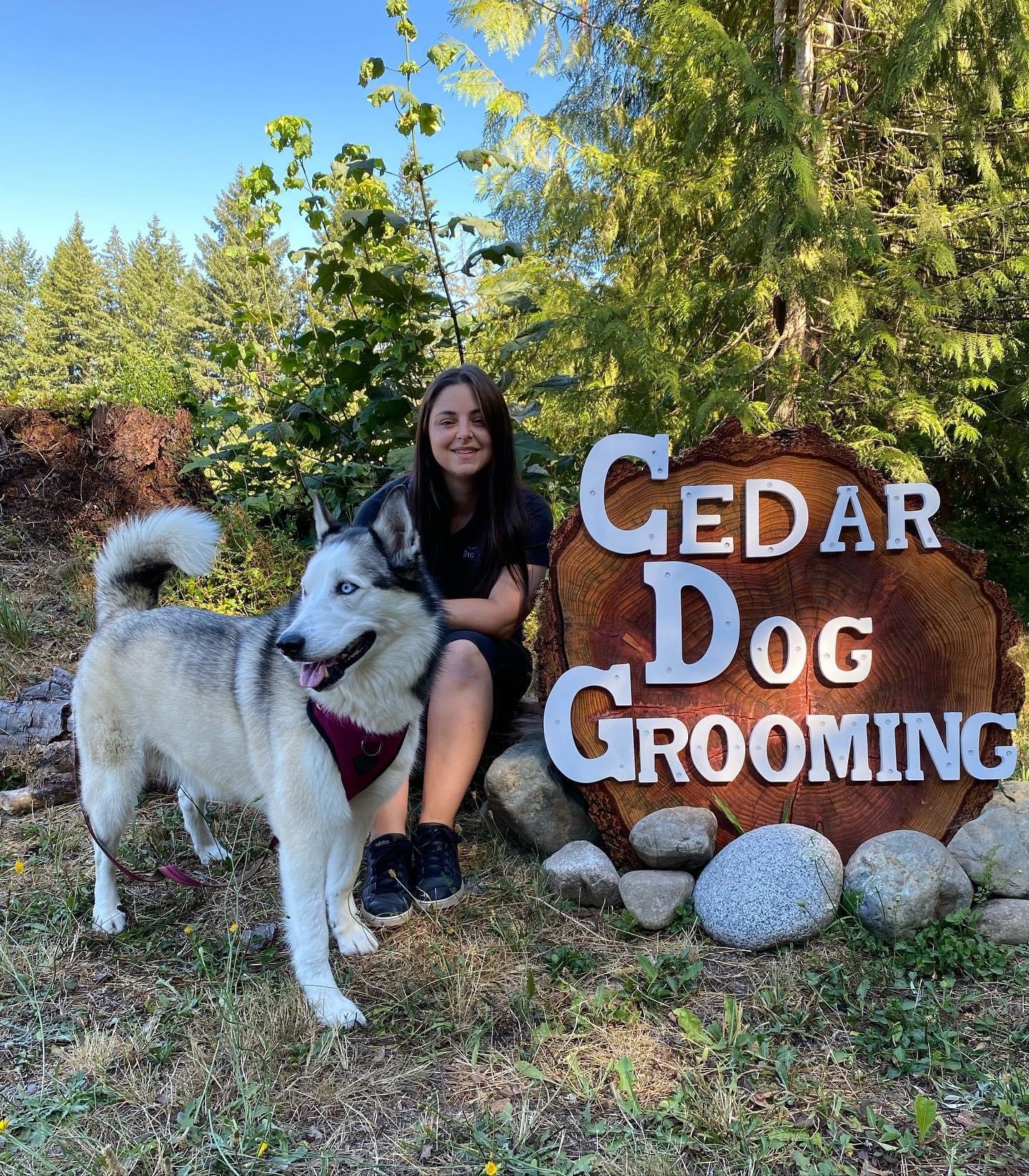 Desiree Lee with husky by Cedar Dog Grooming Sign