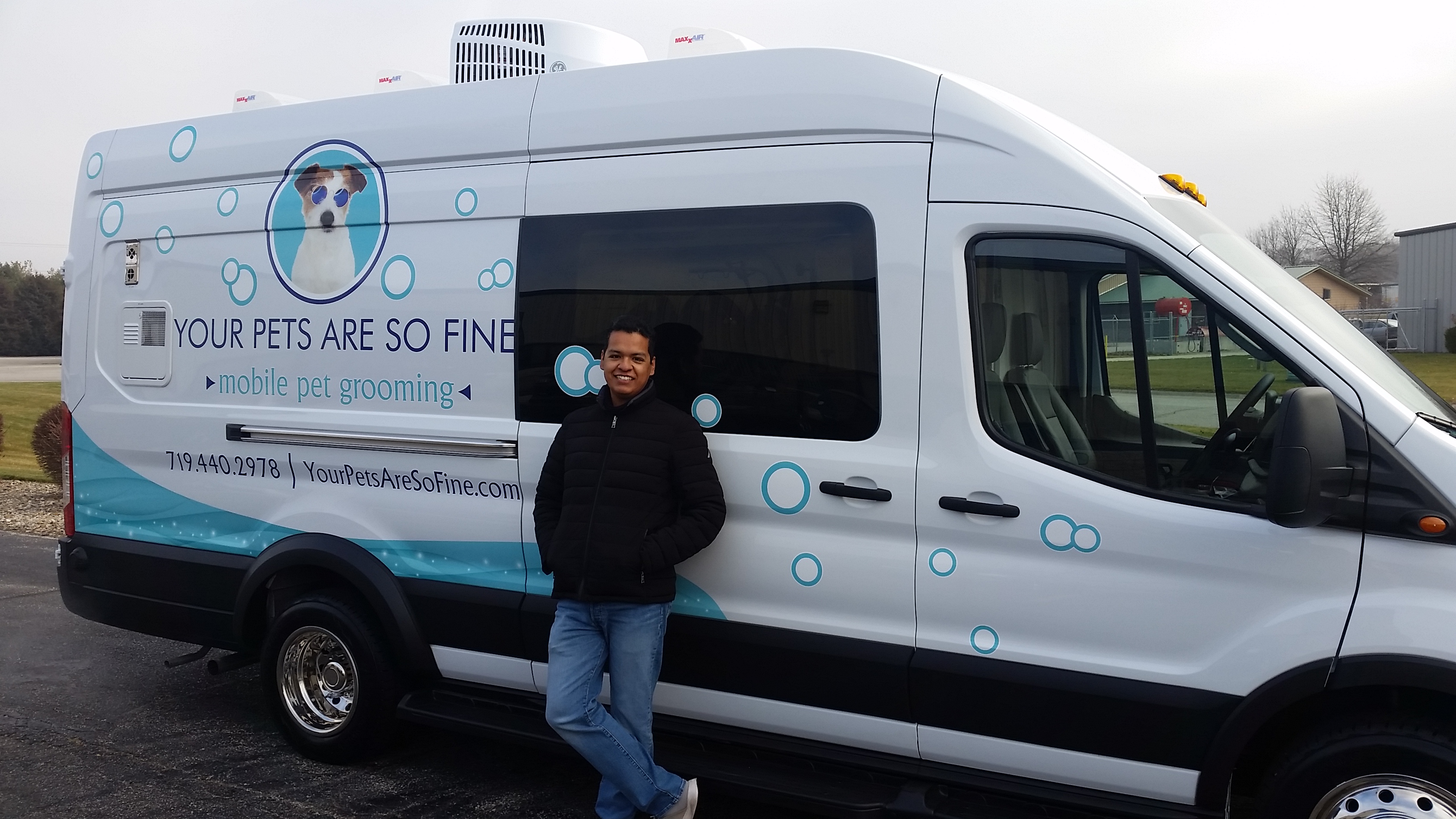 Ricardo Hernandez with his mobile grooming van